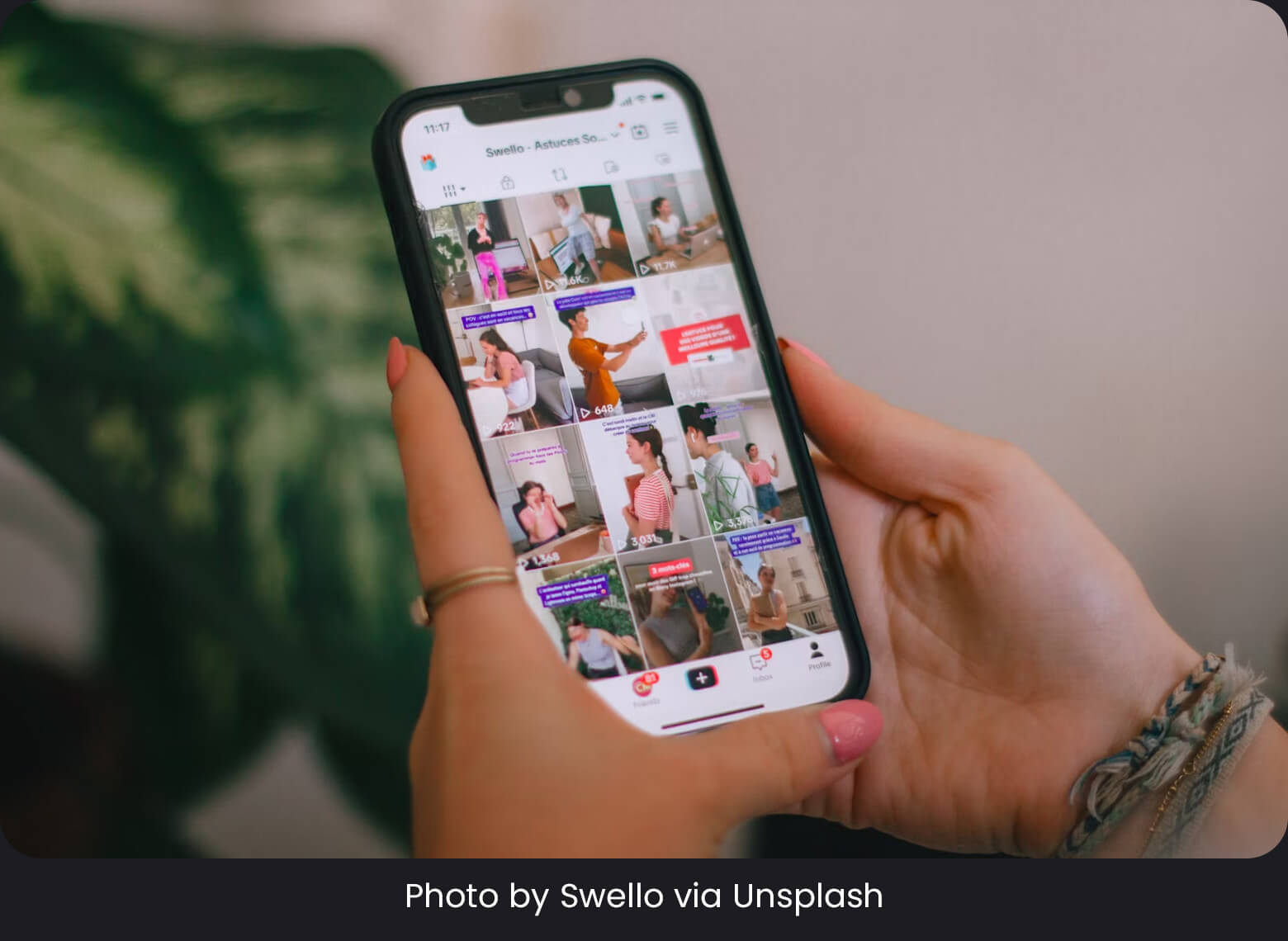 A hand holding a mobile phone